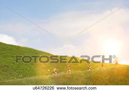 Stock Photograph - Group jogging up hillside. Fotosearch