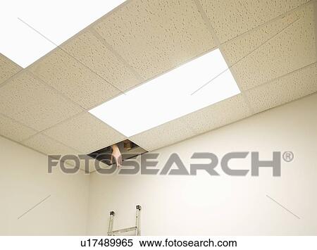 Hand reaching from hole in ceiling View Large Photo Image Stock Photography - Hand reaching from hole in ceiling. Fotosearch
