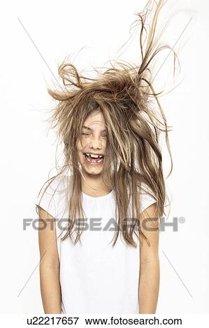 Happy girl with flying hair, white background View Large Photo Image Stock Photo - Happy girl with flying hair, white background. Fotosearch