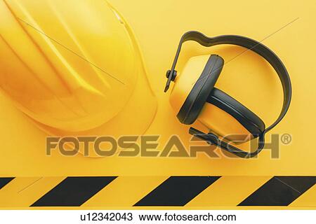Hard hat and earmuffs View Large Photo Image Stock Image - Hard hat and earmuffs. Fotosearch