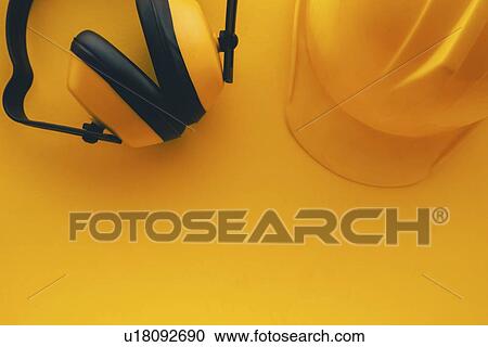 Stock Image - Hard hat and earmuffs. Fotosearch