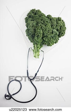 Heart shaped kale leaves and stethoscope View Large Photo Image Stock Image - Heart shaped kale leaves and stethoscope. Fotosearch