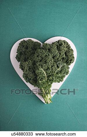 Stock Image - Heart shaped kale leaves. Fotosearch