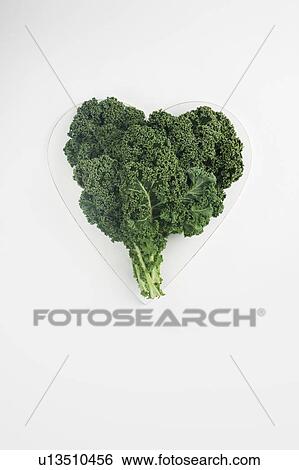 Stock Photograph - Heart shaped kale leaves. Fotosearch