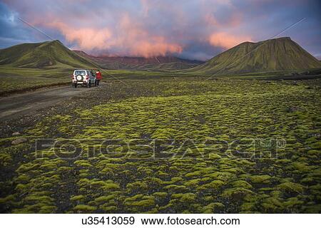 Hiker exploring mossy landscape, Landmannalaugar, Highlands, Iceland View Large Photo Image Stock Photo - Hiker exploring mossy landscape, Landmannalaugar, Highlands, Iceland. Fotosearch