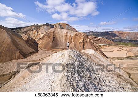 Hiker on peak, Brennisteinsalda and Blhnjkur, Landmannalaugar, Highlands, Iceland View Large Photo Image Stock Photography - Hiker on peak, Brennisteinsalda and Blhnjkur, Landmannalaugar, Highlands, Iceland. Fotosearch