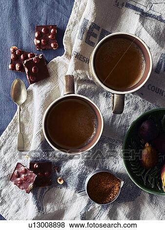 Hot chocolate drink, hazelnut chocolate and fruit pudding View Large Photo Image Stock Photo - Hot chocolate drink, hazelnut chocolate and fruit pudding. Fotosearch