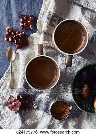 Hot chocolate drink, hazelnut chocolate and fruit pudding View Large Photo Image Stock Photograph - Hot chocolate drink, hazelnut chocolate and fruit pudding. Fotosearch