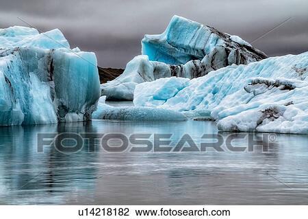Stock Image - Icebergs floating in glacier lagoon, Jokulsarlon Lagoon, Iceland. Fotosearch