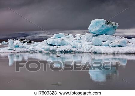 Icebergs floating in glacier lagoon, Jokulsarlon Lagoon, Iceland View Large Photo Image Stock Image - Icebergs floating in glacier lagoon, Jokulsarlon Lagoon, Iceland. Fotosearch