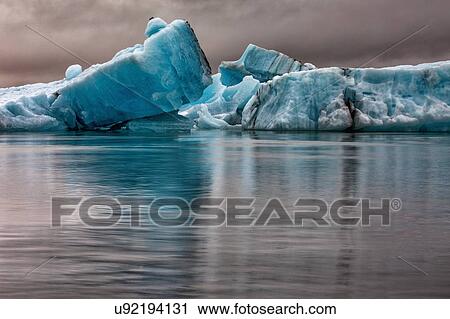 Stock Image - Icebergs floating in glacier lagoon, Jokulsarlon Lagoon, Iceland. Fotosearch