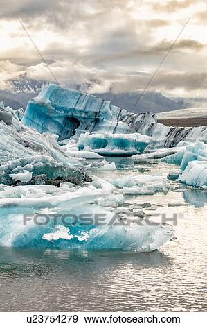 Icebergs floating in glacier lagoon, Jokulsarlon Lagoon, Iceland View Large Photo Image Stock Photo - Icebergs floating in glacier lagoon, Jokulsarlon Lagoon, Iceland. Fotosearch