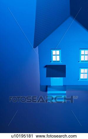 Stock Image - Illuminated model house. Fotosearch