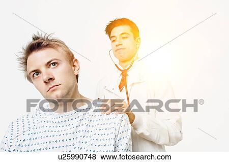 Indian male doctor checking the temperature of caucasian patient View Large Photo Image Stock Photo - Indian male doctor checking the temperature of caucasian patient. Fotosearch
