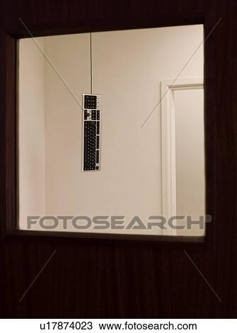 Stock Image - Keyboard hanging from ceiling. Fotosearch