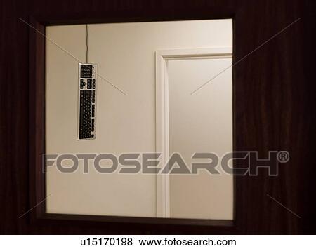 Stock Photo - Keyboard hanging from ceiling. Fotosearch