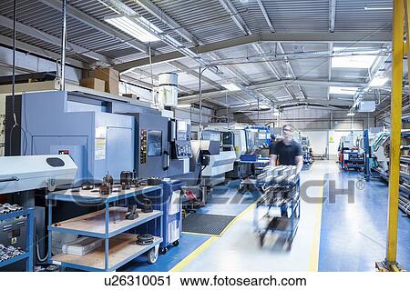 Lathes and metal working machinery in electronics assembly factory View Large Photo Image Stock Image - Lathes and metal working machinery in electronics assembly factory. Fotosearch