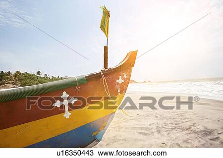 Stock Image - Life boat on Indian Goa Beach. Fotosearch