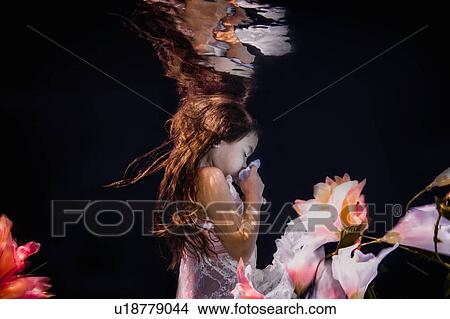 Little girl in underwater garden View Large Photo Image Picture - Little girl in underwater garden. Fotosearch