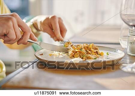 Man having meal in restaurant View Large Photo Image Stock Image - Man having meal in restaurant. Fotosearch