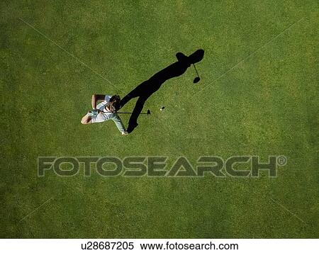 Man playing golf on golf course View Large Photo Image Stock Photography - Man playing golf on golf course. Fotosearch
