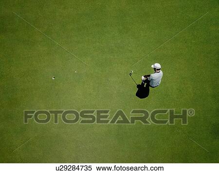 Man playing golf on golf course View Large Photo Image Stock Photography - Man playing golf on golf course. Fotosearch
