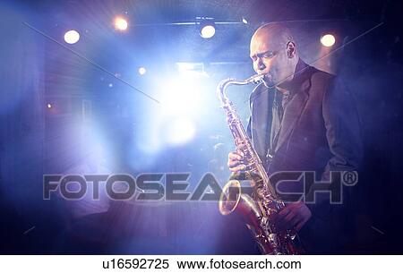 Man Playing Saxophone on Stage View Large Photo Image Stock Photography - Man Playing Saxophone on Stage. Fotosearch