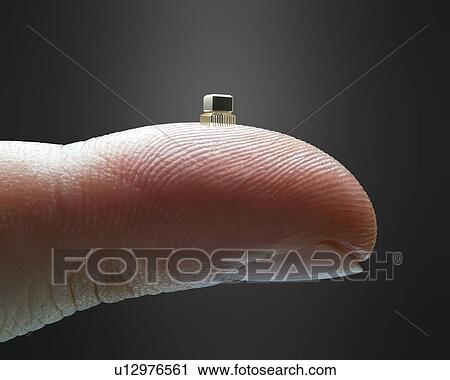 Microchip on finger View Large Photo Image Stock Image - Microchip on finger. Fotosearch