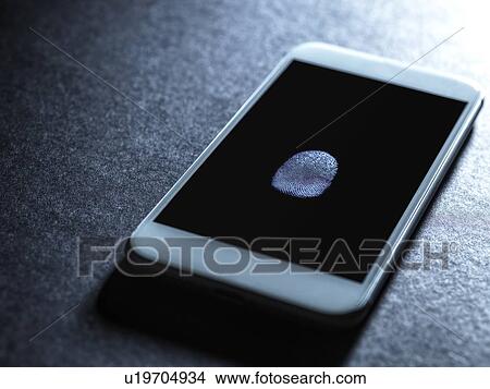 Picture - Mobile phone being accessed using finger print identity. Fotosearch