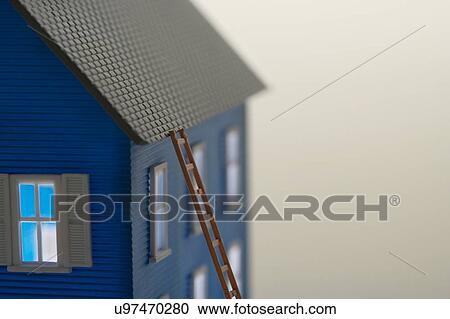 Model of house with ladder close-up View Large Photo Image Stock Image - Model of house with ladder close-up. Fotosearch