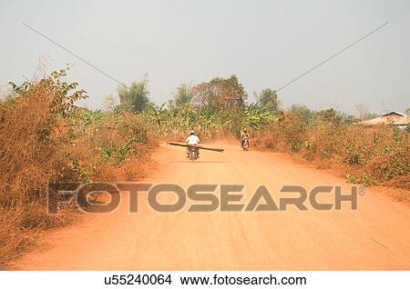 Motorcycles on rural Dirt Road in Asia View Large Photo Image Picture - Motorcycles on rural Dirt Road in Asia. Fotosearch