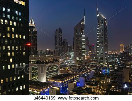 Stock Photo - Night scene, Jumeirah Emirates Towers, Dubai, UAE. Fotosearch