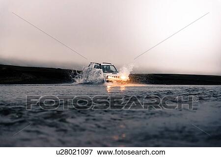 Off road vehicle driving in river, Landmannalaugar, Iceland View Large Photo Image Stock Photo - Off road vehicle driving in river, Landmannalaugar, Iceland. Fotosearch