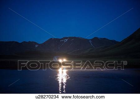 Picture - Off road vehicle in desert at night, Landmannalaugar, Highlands, Iceland. Fotosearch