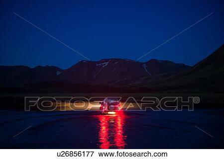 Stock Photo - Off road vehicle in desert at night, Landmannalaugar, Highlands, Iceland. Fotosearch