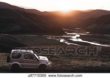 Off road vehicle in desert, sunset over mountain ranges, Landmannalaugar, Highlands, Iceland View Large Photo Image Stock Photography - Off road vehicle in desert, sunset over mountain ranges, Landmannalaugar, Highlands, Iceland. Fotosearch
