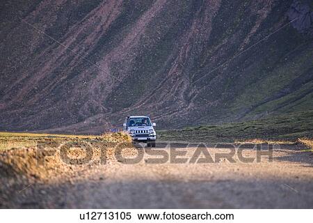 Off road vehicle on dirt road, mountain in background, Landmannalaugar, Highlands, Iceland View Large Photo Image Stock Photography - Off road vehicle on dirt road, mountain in background, Landmannalaugar, Highlands, Iceland. Fotosearch