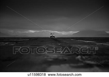 Off road vehicle on dirt track, black cloudy sky in background, Landmannalaugar, Iceland View Large Photo Image Stock Photo - Off road vehicle on dirt track, black cloudy sky in background, Landmannalaugar, Iceland. Fotosearch