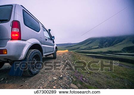 Off road vehicle on dirt track heading to hills, Landmannalaugar, Iceland View Large Photo Image Stock Photo - Off road vehicle on dirt track heading to hills, Landmannalaugar, Iceland. Fotosearch