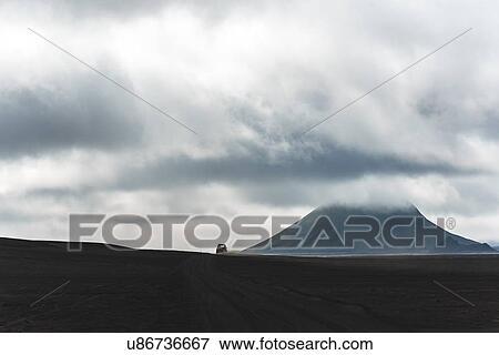Off road vehicle, volcano in distance, Landmannalaugar, Iceland View Large Photo Image Stock Photo - Off road vehicle, volcano in distance, Landmannalaugar, Iceland. Fotosearch