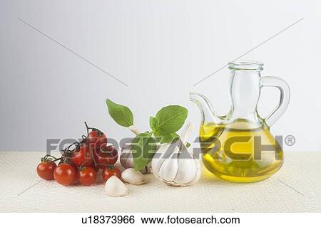 Olive oil, basil, garlic and tomato View Large Photo Image Stock Photograph - Olive oil, basil, garlic and tomato. Fotosearch