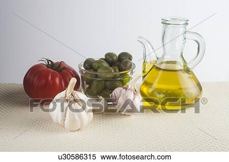 Olive oil, olives, garlic and tomato View Large Photo Image Stock Photography - Olive oil, olives, garlic and tomato. Fotosearch