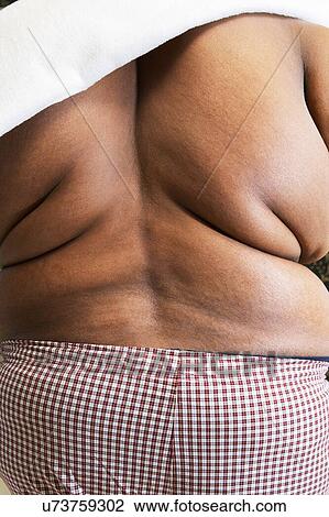Overweight man with bare back View Large Photo Image Stock Image - Overweight man with bare back. Fotosearch