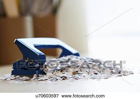 Stock Photo - Paper Bits by Hole Punch. Fotosearch