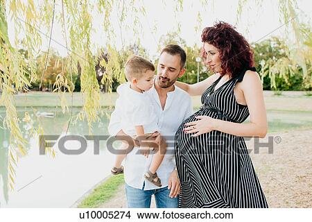Parents with son in park View Large Photo Image Picture - Parents with son in park. Fotosearch
