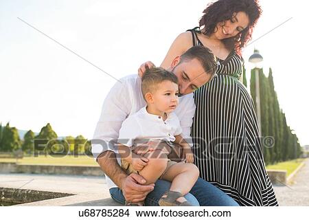 Picture - Parents with son in park. Fotosearch