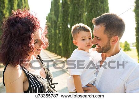 Stock Photo - Parents with son in park. Fotosearch