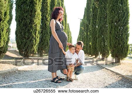 Stock Photography - Parents with son in park. Fotosearch