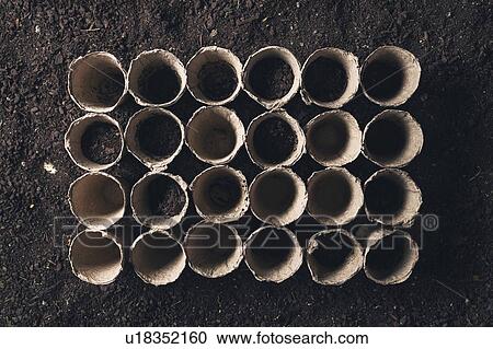Stock Image - Peat pots and soil. Fotosearch