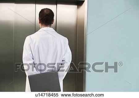Physician Waiting for the Elevator View Large Photo Image Stock Photography - Physician Waiting for the Elevator. Fotosearch